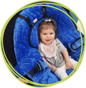 Avery sitting in blue pea pod chair