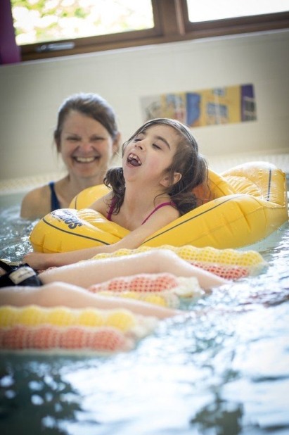 Girl with carer in the hydrotherapy pool