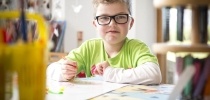 Boy enjoying messy play at Little Harbour hospice thumbnail