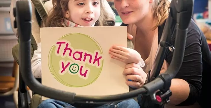 Girl with thank you sign