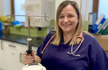 Woman in nurses uniform smiling