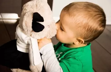 Child and teddy bear
