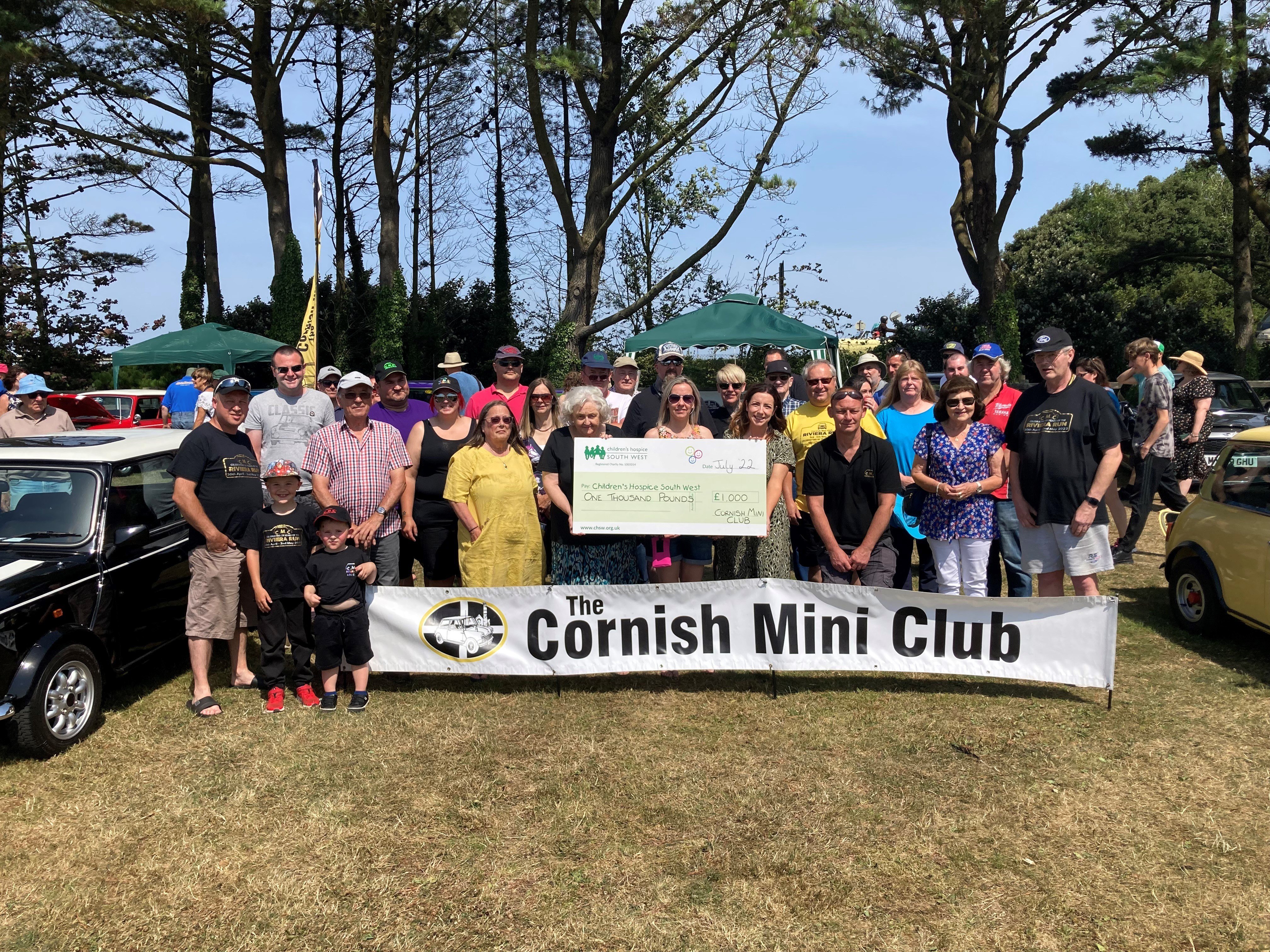 Cornish Mini Club members handover their donation to Bernadette from CHSW