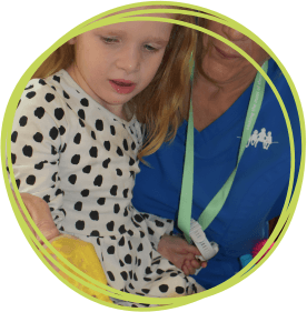 A child and a nurse in messy play