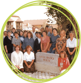 The original CHSW care team pictured outside Little Bridge House in 1995