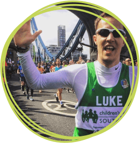 Luke Compton pictured crossing Tower Bridge in the 2017 Virgin Money London Marathon for Children's Hospice South West