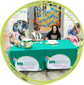 Young Ambassadors at an event stand