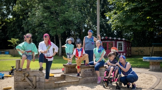 Group of adults and children outside dressed up as pirates