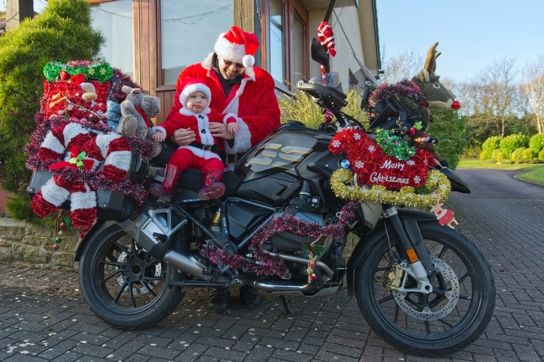 Motorbiking Santas arrive at Little Bridge House. Picture by Will Badman Photography