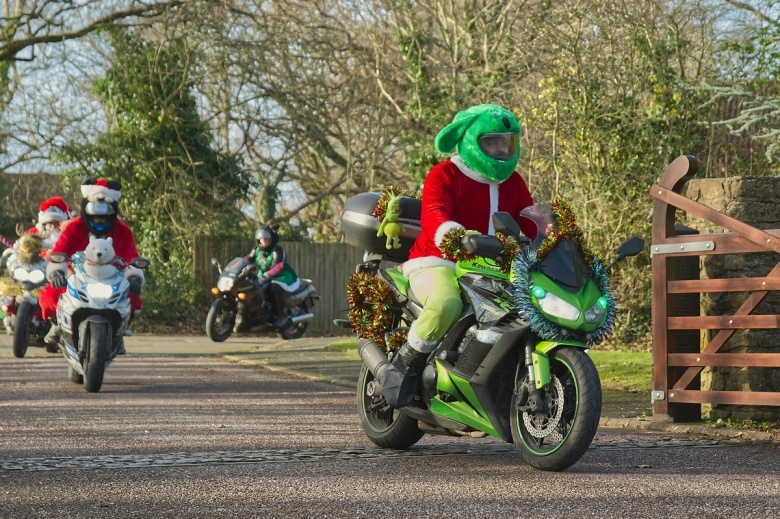 Motorbiking Santas arrive at Little Bridge House. Picture by Will Badman Photography.