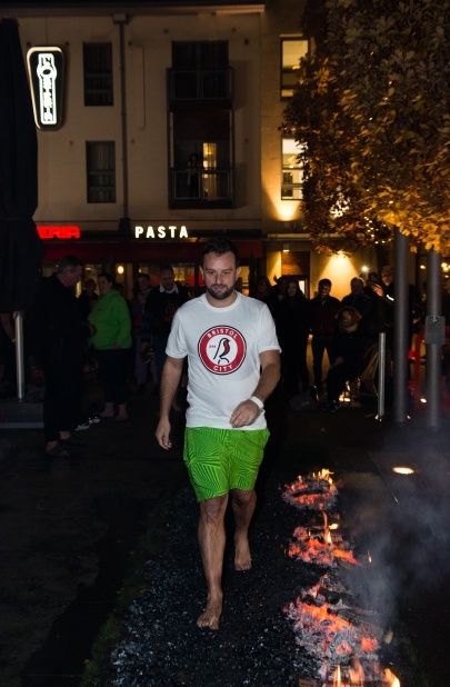 CHSW Firewalk event participant walking on hot coals