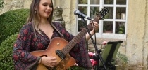 Female musician at Iford Manor thumbnail