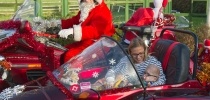 Motorbiking Santas arrive at Little Bridge House. Picture by Will Badman Photography thumbnail