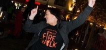 Woman smiling and celebrating after she completes her firewalk challenge for CHSW thumbnail