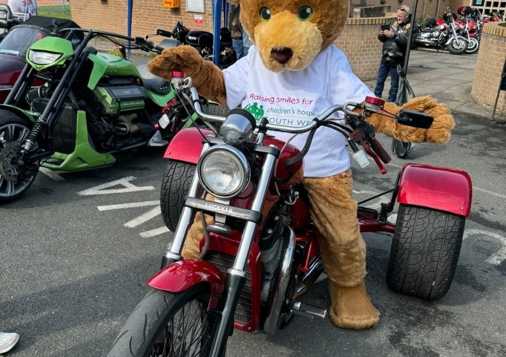 Buddy the mascot on a motorbike