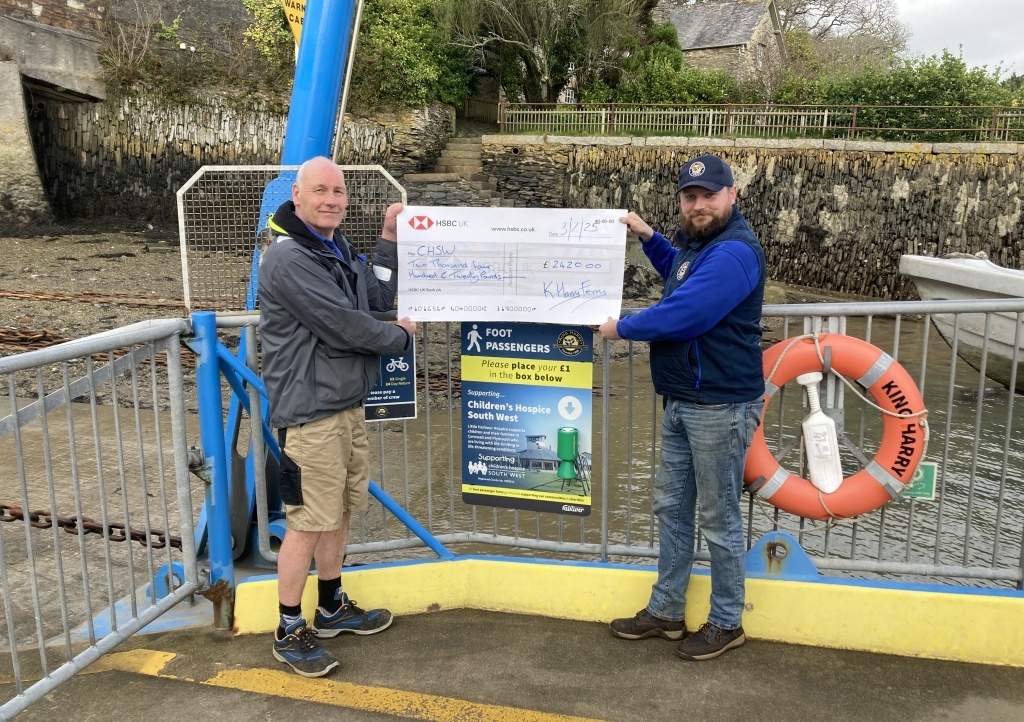 The ferry staff presenting their cheque 