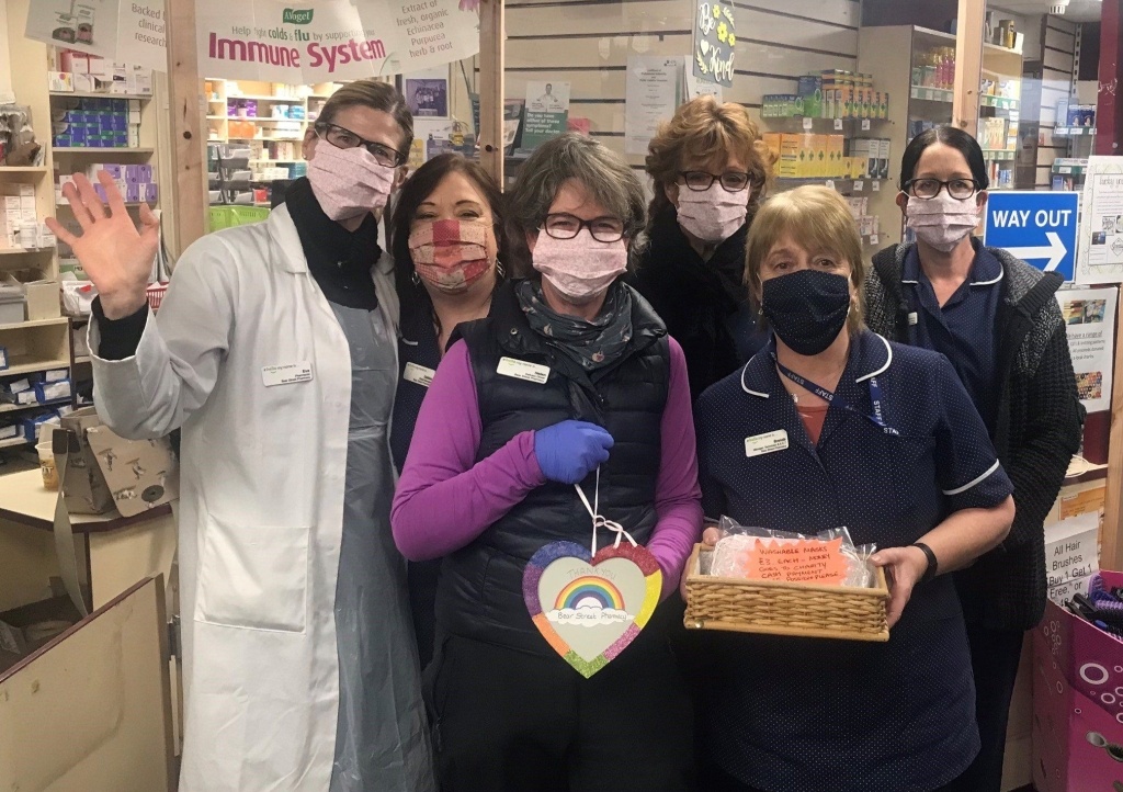 Brenda Loder (pictured second right) and her colleagues at the Bear Street Pharmacy in Barnstaple have been selling homemade facemasks in aid of Children’s Hospice South West