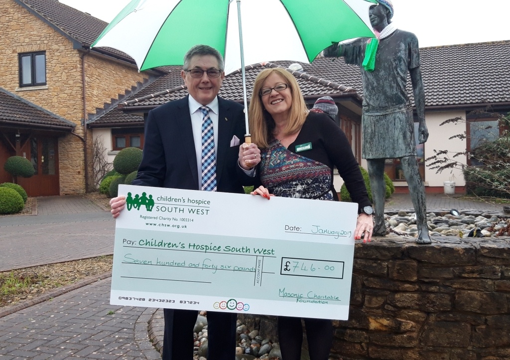 W. Bro. Charles Yelland Assistant Provincial Grand Master of the Devonshire Freemasons, presents a cheque for £746 to Ann Juby, major gifts, trusts and grants fundraiser at Children’s Hospice South West