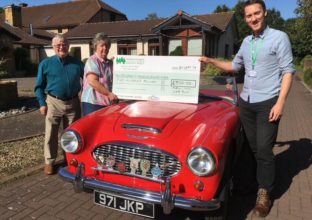Diane and Bob Harrison present their fundraising cheque to CHSW community fundraising assistant Neville Pope at Little Bridge House
