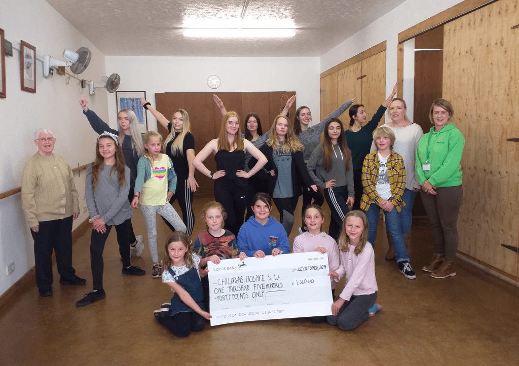June Bealey (left) and Lisa-Jayne Flynn and Children's Hospice South West Community Fundraiser Laura Robertson (right) with students from the June Bealey School of Dance