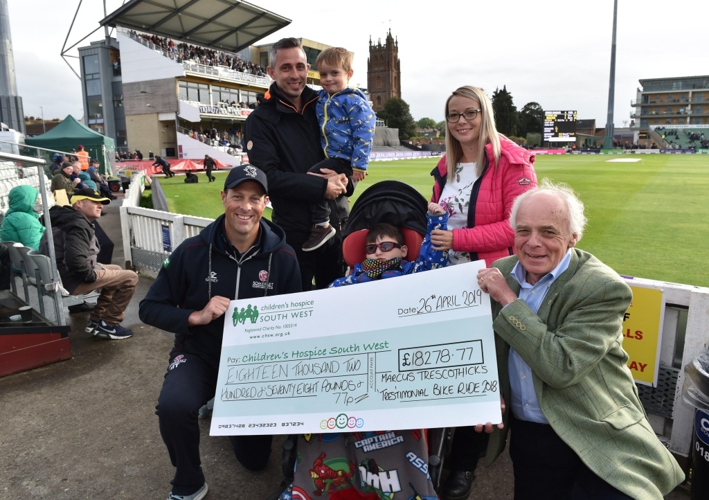 Kevin Morris, Finley's mum Louise Jackson and Finley's little brother Jett join Marcus Trescothick to present the cheque to CHSW chief executive and founder Eddie Farwell. Picture: Geoff Roberts