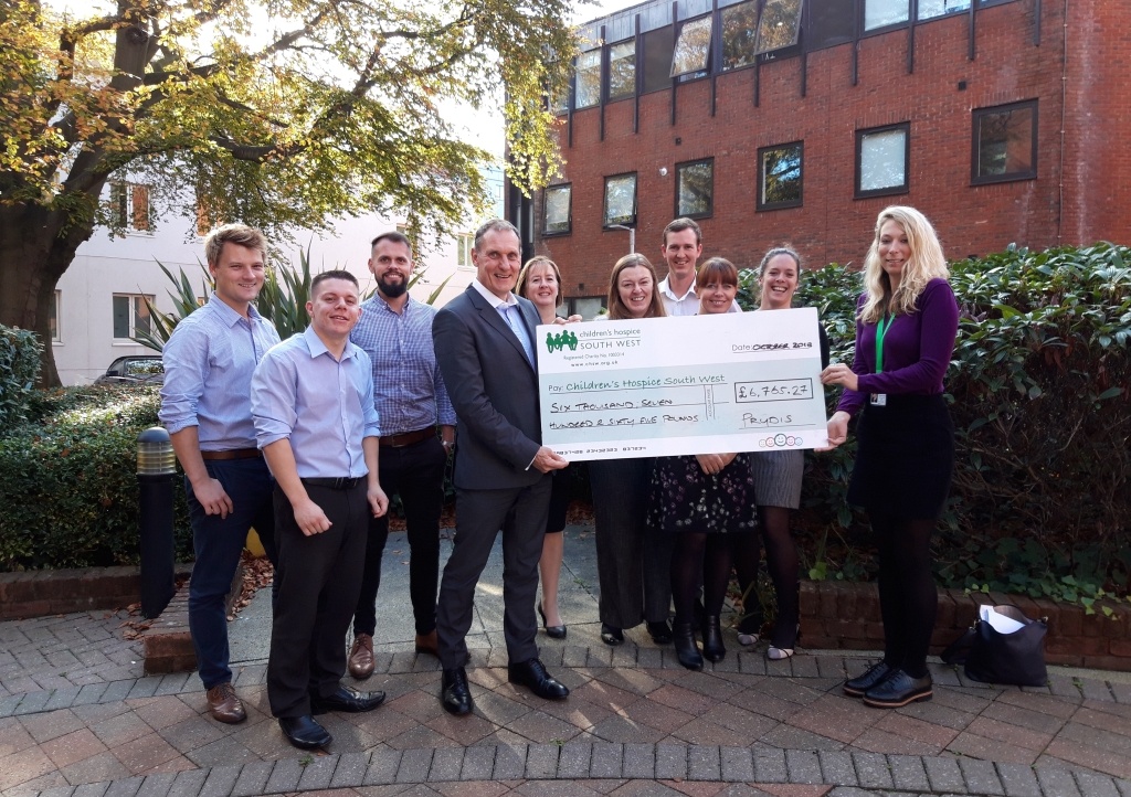 Compliance director Paul White and the Prydis team present their fundraising cheque to Children’s Hospice South West Corporate Partnerships Fundraiser Mhairi Bass-Carruthers