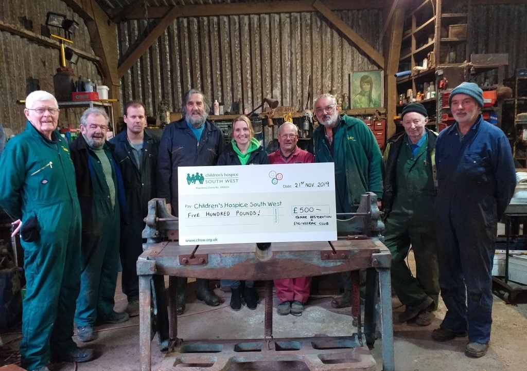 Members of Tamar Restoration and Engineering Club hand over their donation to Zoe from CHSW