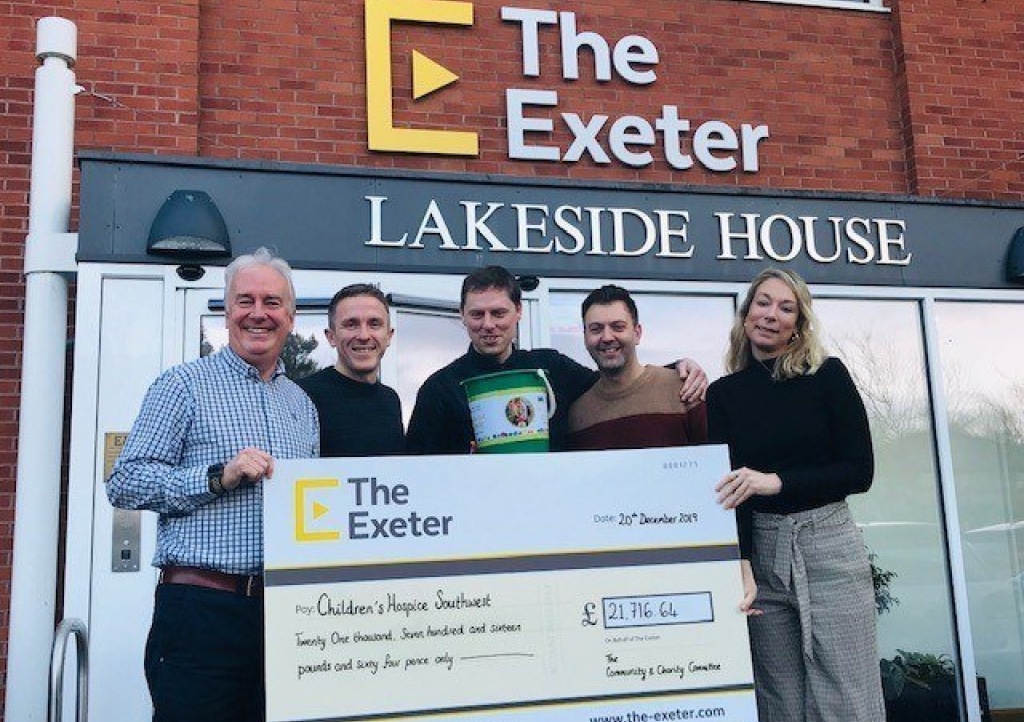 The Exeter Chief Executive Andy Chapman and Community and Charity Committee members Ryan Tumulty, Mark Crossley-May and Lee Crichard present the 2019 fundraising total to CHSW Corporate Partnerships Fundraiser Mhairi Bass-Carruthers.