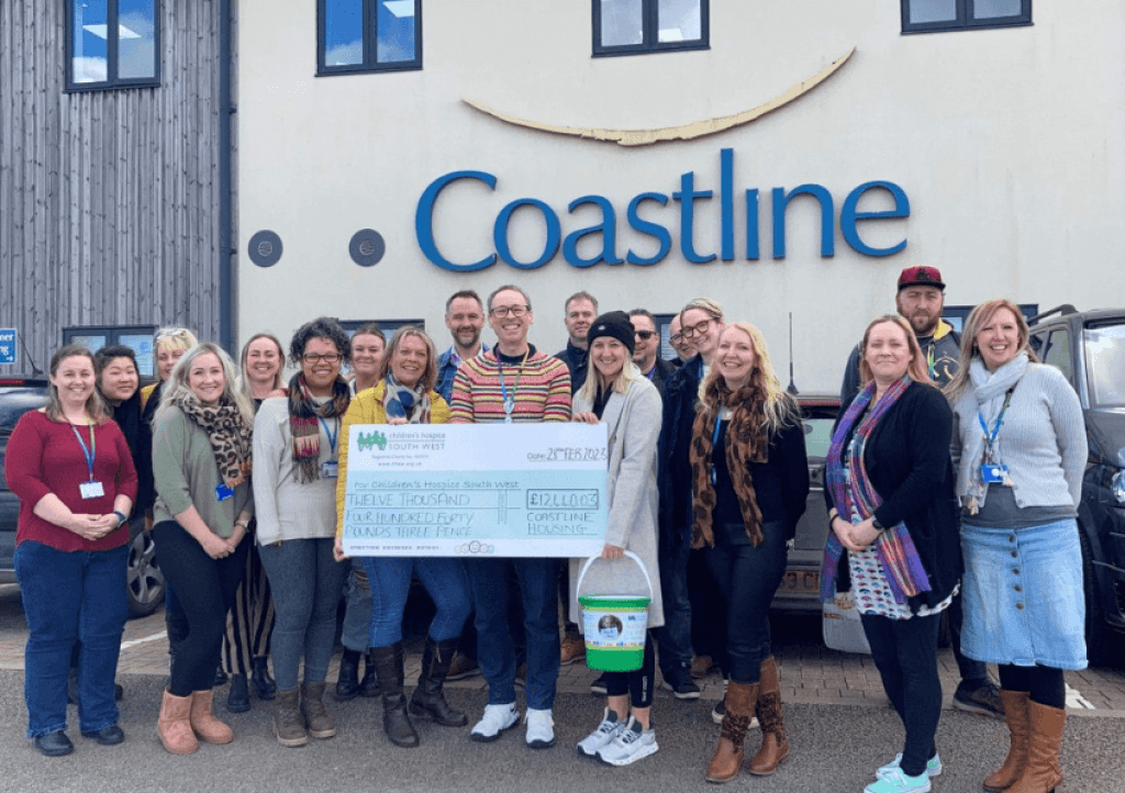The Coastline team presenting their cheque