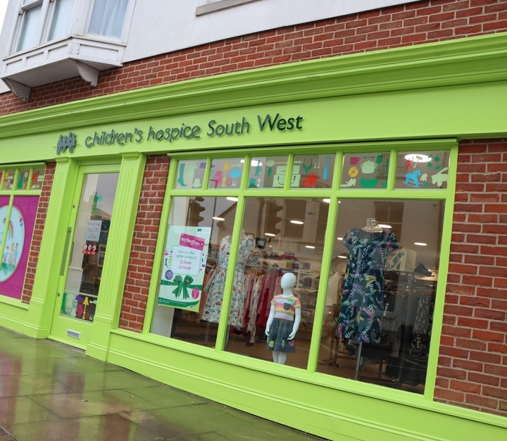 Shop front with bright green signs Shop front with bright green signs