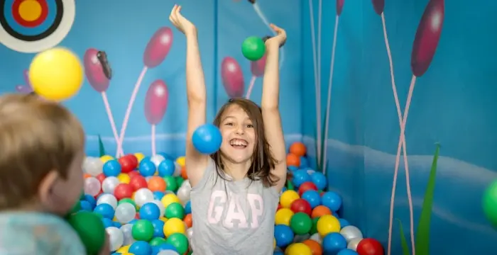 Girl in the soft play at Little Bridge House