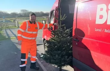 Conan Oakes collecting trees with the Biffa team